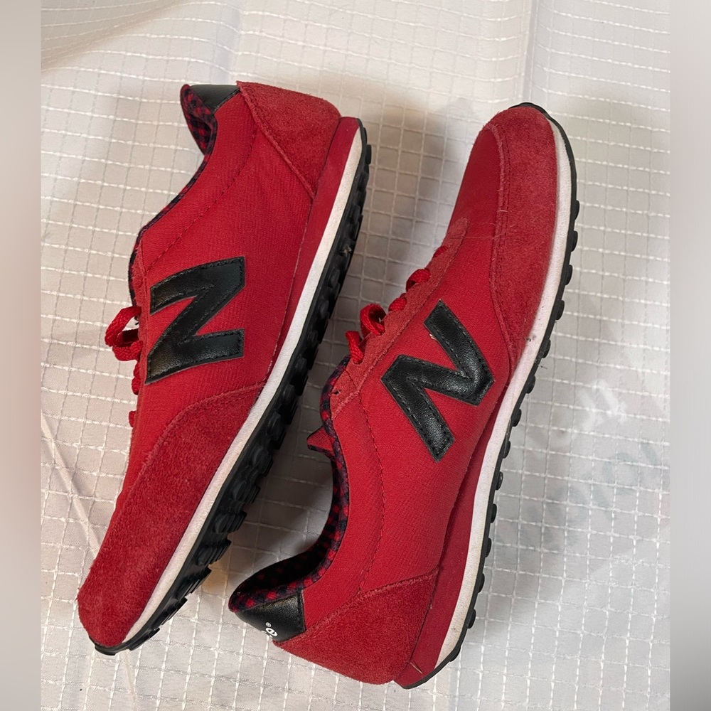 Never worn New Balance 410 size 8.5 red with navy & red plaid lining
